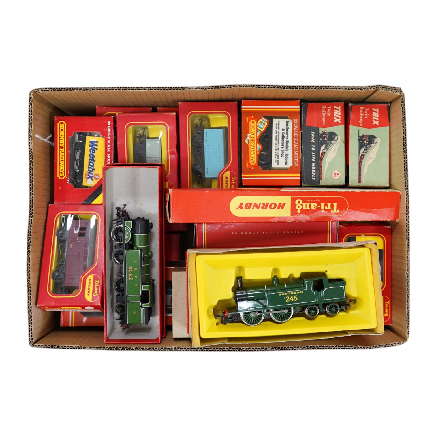 A collection of boxed 00 gauge railway, mainly by Tri-ang Hornby, including six locomotives (one unboxed), together with twenty-five freight wagons. Condition - good.